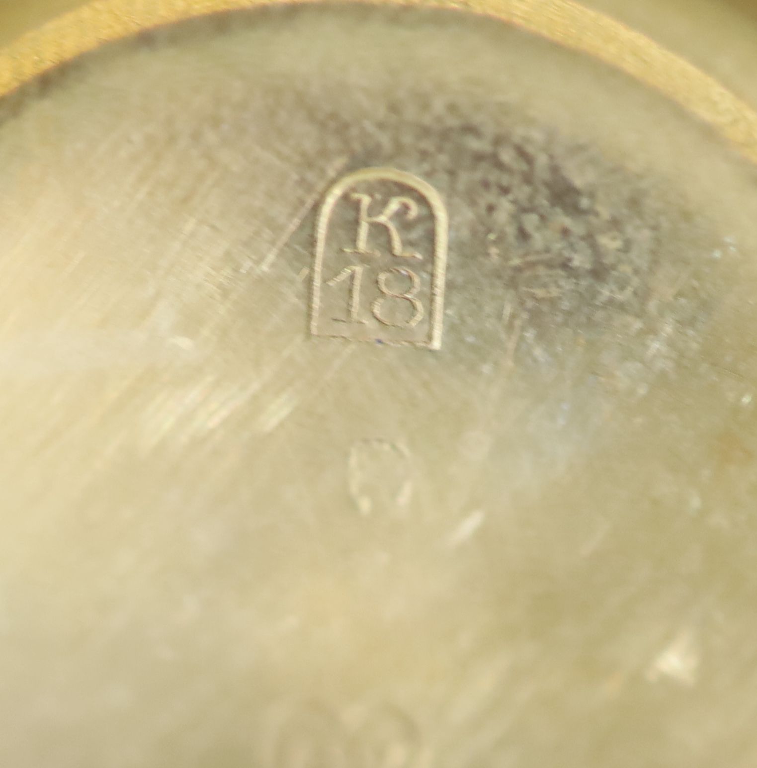 An early 20th century Swiss engine turned 18k gold hunter keyless fob watch,